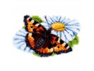 knüpfdecke vlinder op margriet
