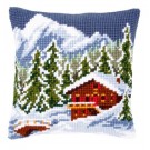 kreuzstichkissen chalet in winters gebergte
